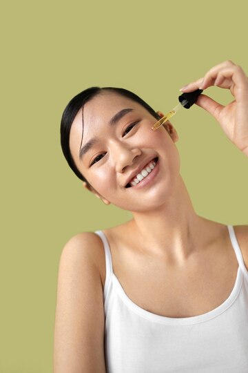 medium-shot-korean-woman-posing-with-serum_23-2150171963